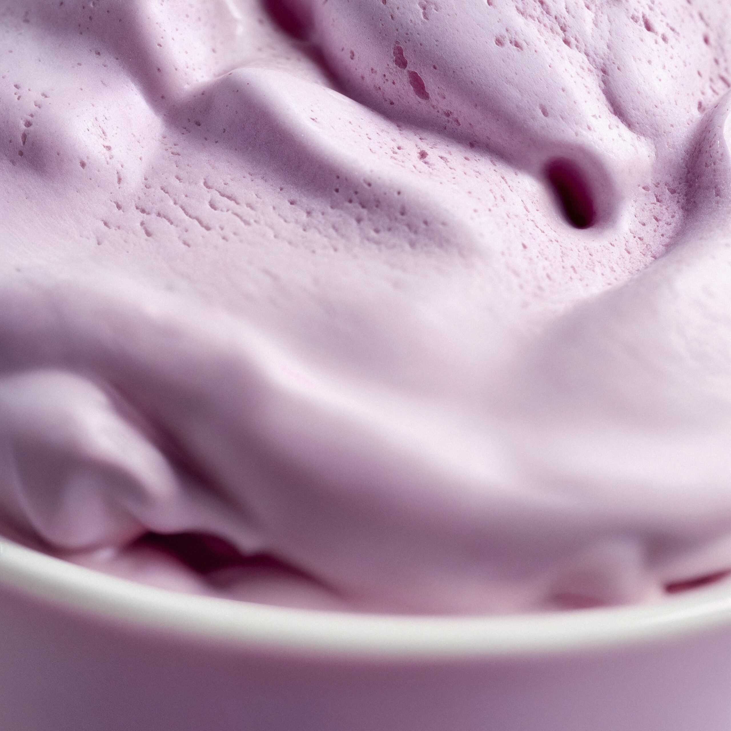 https://heladoslacascada.com/wp-content/uploads/2024/11/lavender-colored-background-with-ice-cream-texture-scaled.jpg